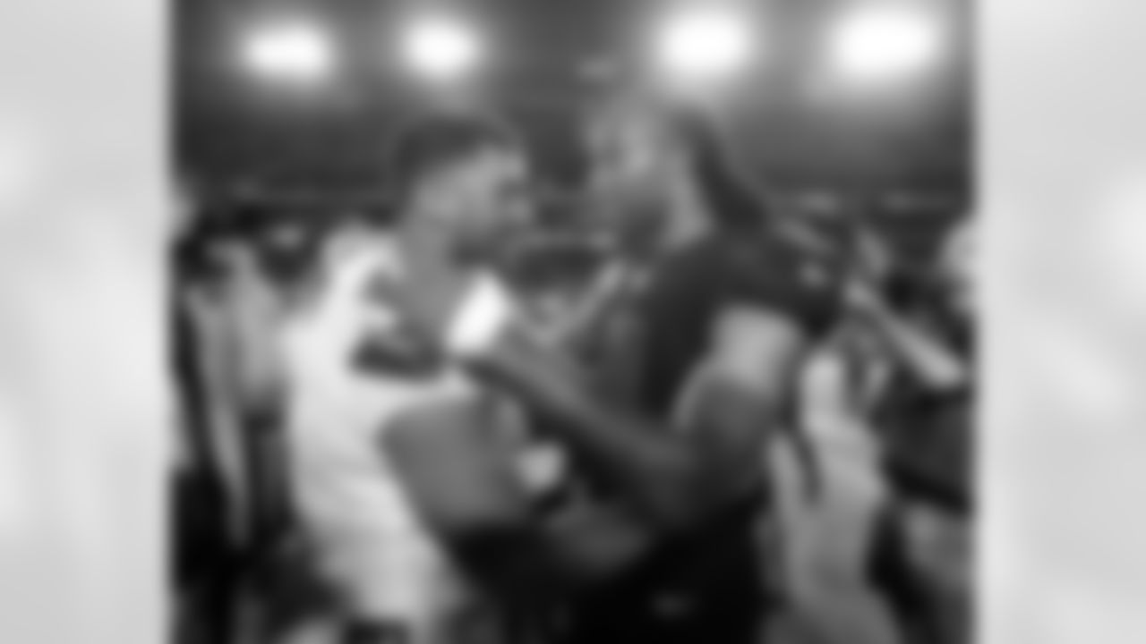 Russell Wilson (left) and Larry Fitzgerald (right) meet after the final whistle