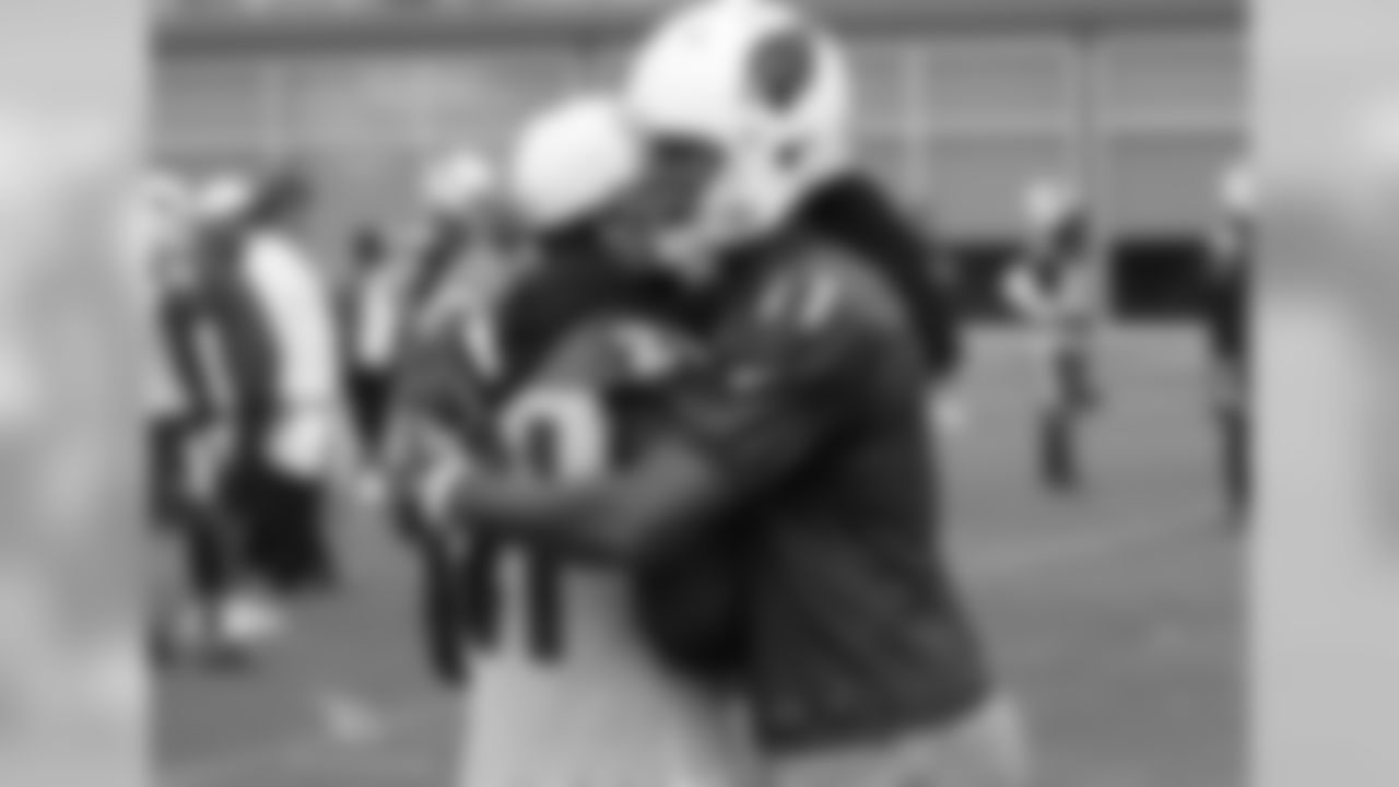 WR Larry Fitzgerald has a hug for sidelined teammate Patrick Peterson