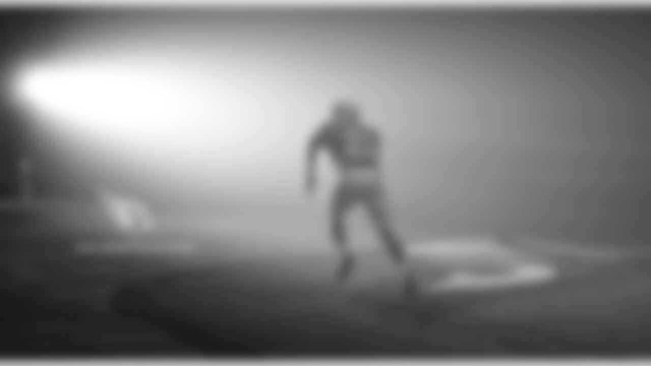 RB T.J. Logan runs to the light