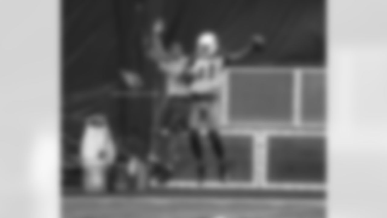 Torry Holt (left) celebrates with WR Larry Fitzgerald