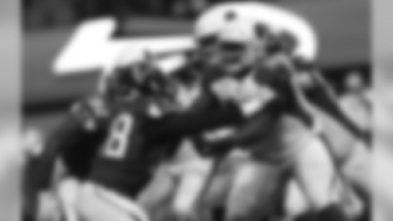 T D.J. Humphries battles with Falcons DE Takkarist McKinley