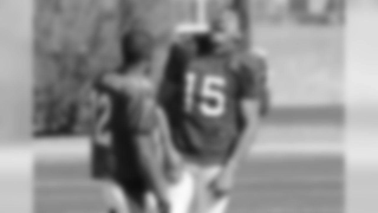 WR Michael Floyd laughs at the outset of practice