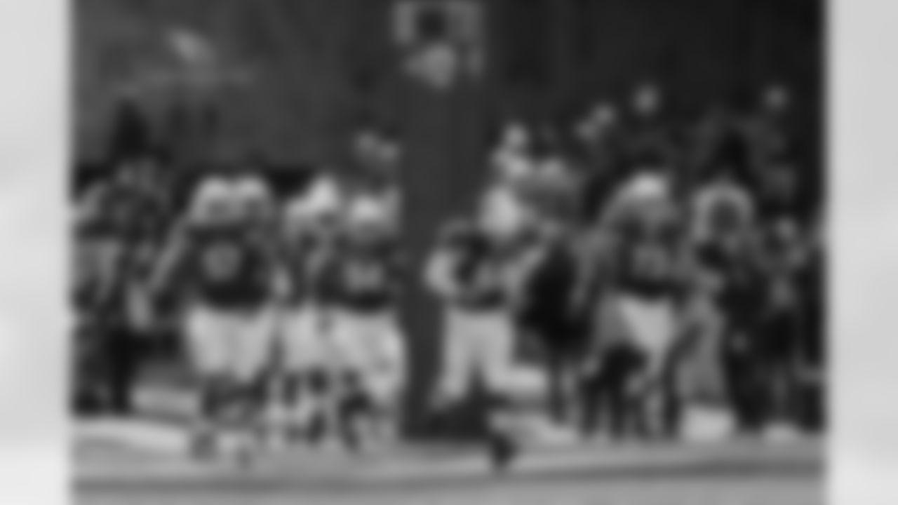 The Cardinals running out of the tunnel in the L.A. Coliseum