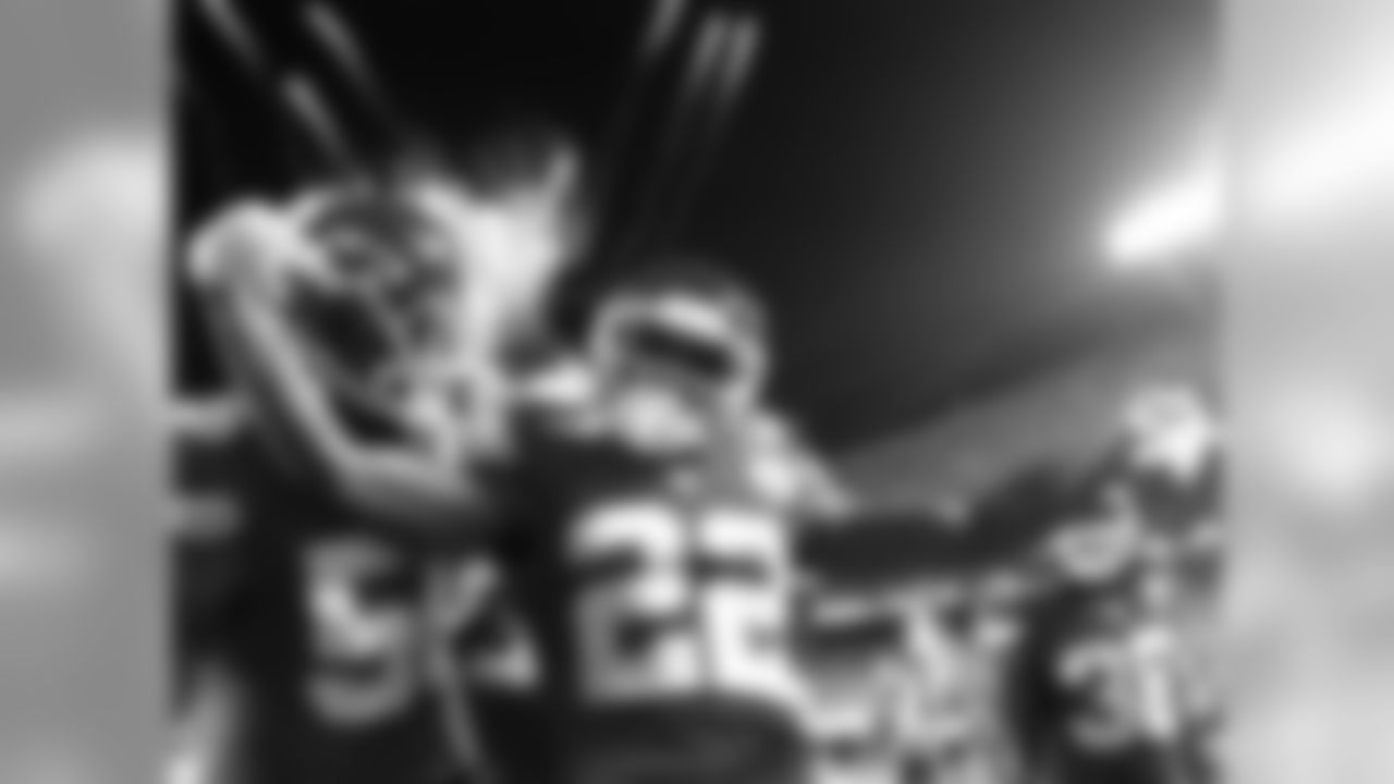 Steve Sanders' comments: "In this particular photo, I like the way it captures the essence of the moment. This is Peters' first touchdown. We started doing fireworks this year after touchdowns. You've got the fireworks in the background. The rest of the teammates are coming over to congratulate him, and he's just so animated. Just really his emotion of scoring that first touchdown really shows through."