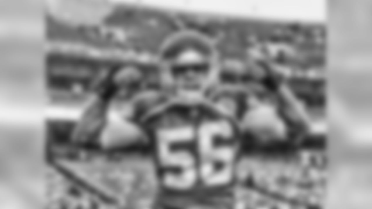 Steve Sanders' comments: "It's in pre-game. The weather was nasty that day. It was raining, as you can see in the picture. Sometimes in pre-games, I can get the players to be a little bit more animated, a little bit more of their personalities show. And I said, 'DJ, do a little something,' and this is what he came up with. That's kind of his go-to. Looking up into the rain, I think it made a great picture."