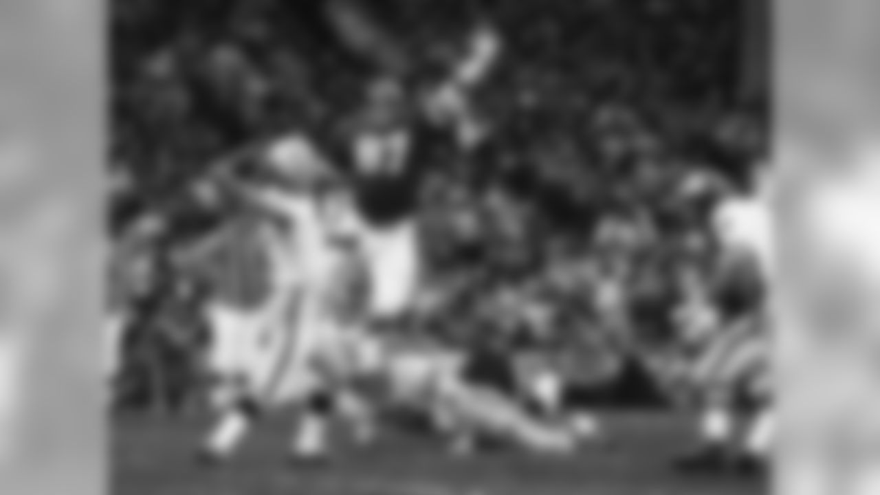 Chiefs Aaron Brown leaps to defend pass against the Oakland Raiders on Nov. 23, 1969.