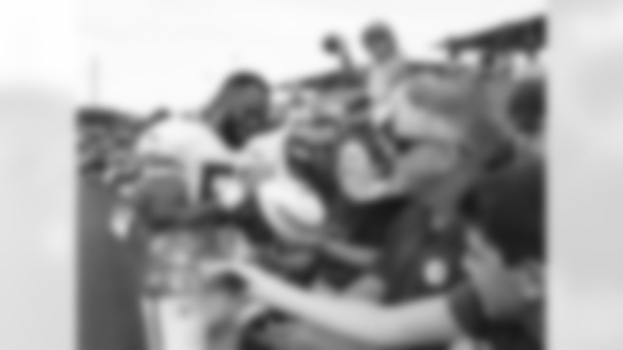 Kansas City Chiefs linebacker Derrick Johnson (56) signs autographs for fans after practice on the fourth day of training camp on Mosaic Life Care Field at the campus of Missouri Western State University on Tuesday, August 2, 2016.