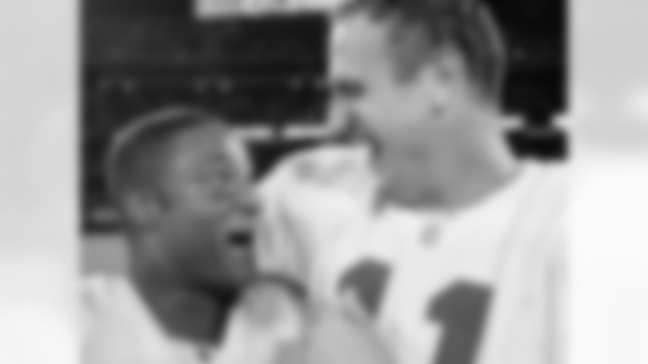 Kansas City Chiefs quarterback Elvis Grbac and receiver Andre Rison were all smiles after Grbac threw the ball to Rison who caught it in the endzone to beat the Oakland Raiders in the last seconds of the game during Monday night football. Chiefs won 28-27.