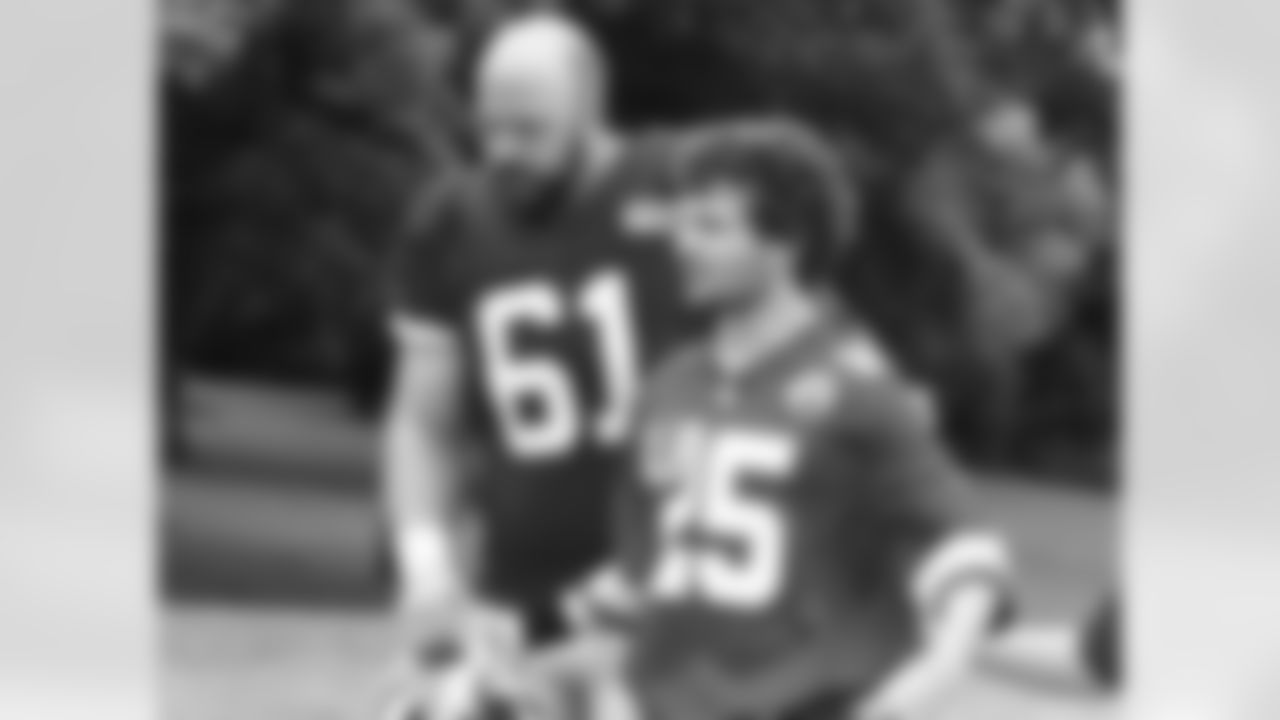 Kansas City Chiefs offensive lineman Mitch Morse (61) walks up the hill with a young fan after practice on the fourth day of training camp on Mosaic Life Care Field at the campus of Missouri Western State University on Tuesday, August 2, 2016.
