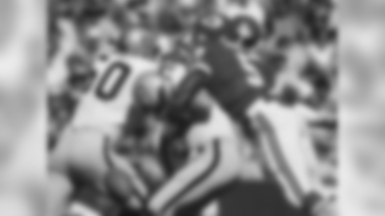 Kansas City Chiefs linebacker Thomas Howard (52) strips the ball from the Oakland Raiders quarterback during a week 4 home game in 1979. The Chiefs won 35-7.