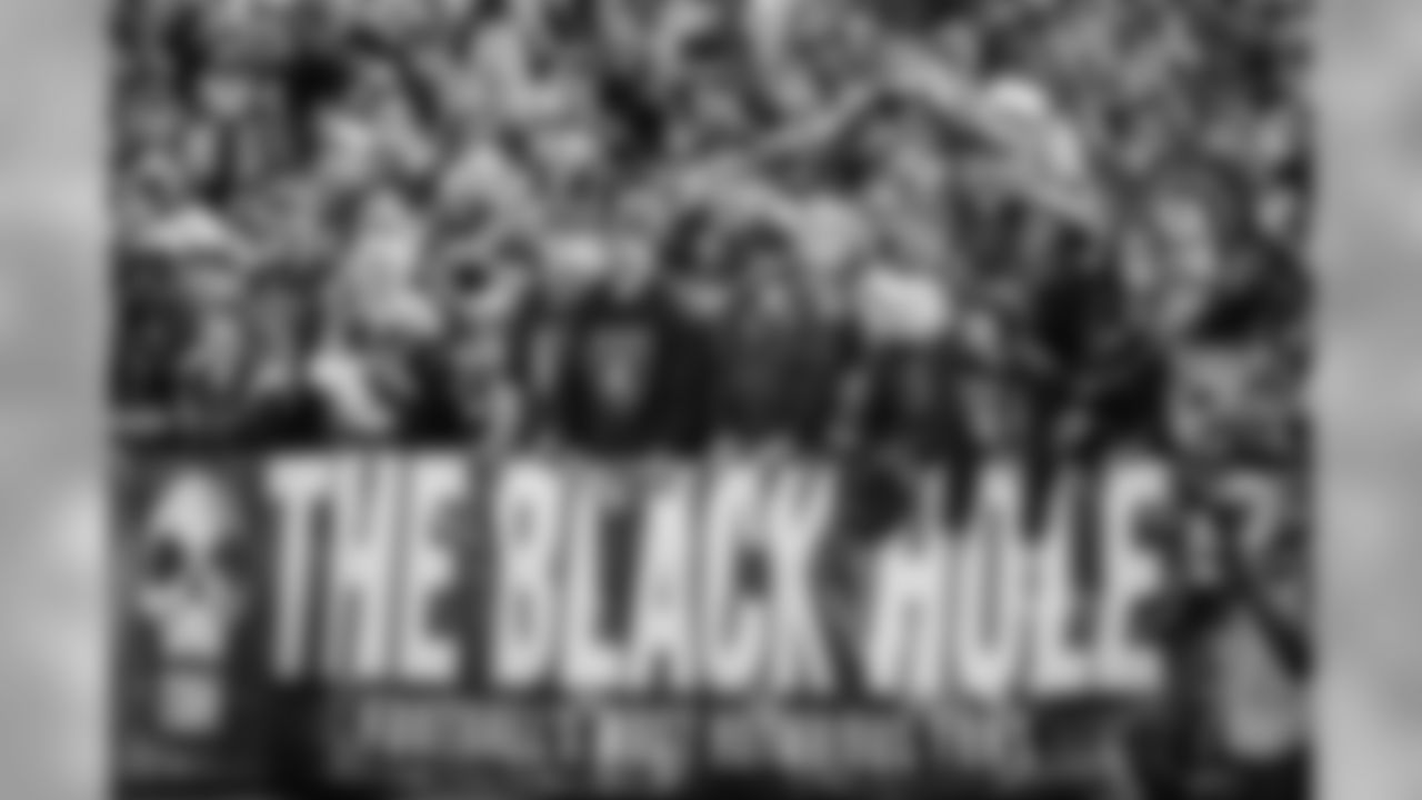 Fans watch from The Black Hole end zone at Oakland Alameda County Coliseum during the first half of an NFL football game between the Oakland Raiders and the Dallas Cowboys in Oakland, Calif., Sunday, Dec. 17, 2017. (AP Photo/Ben Margot)