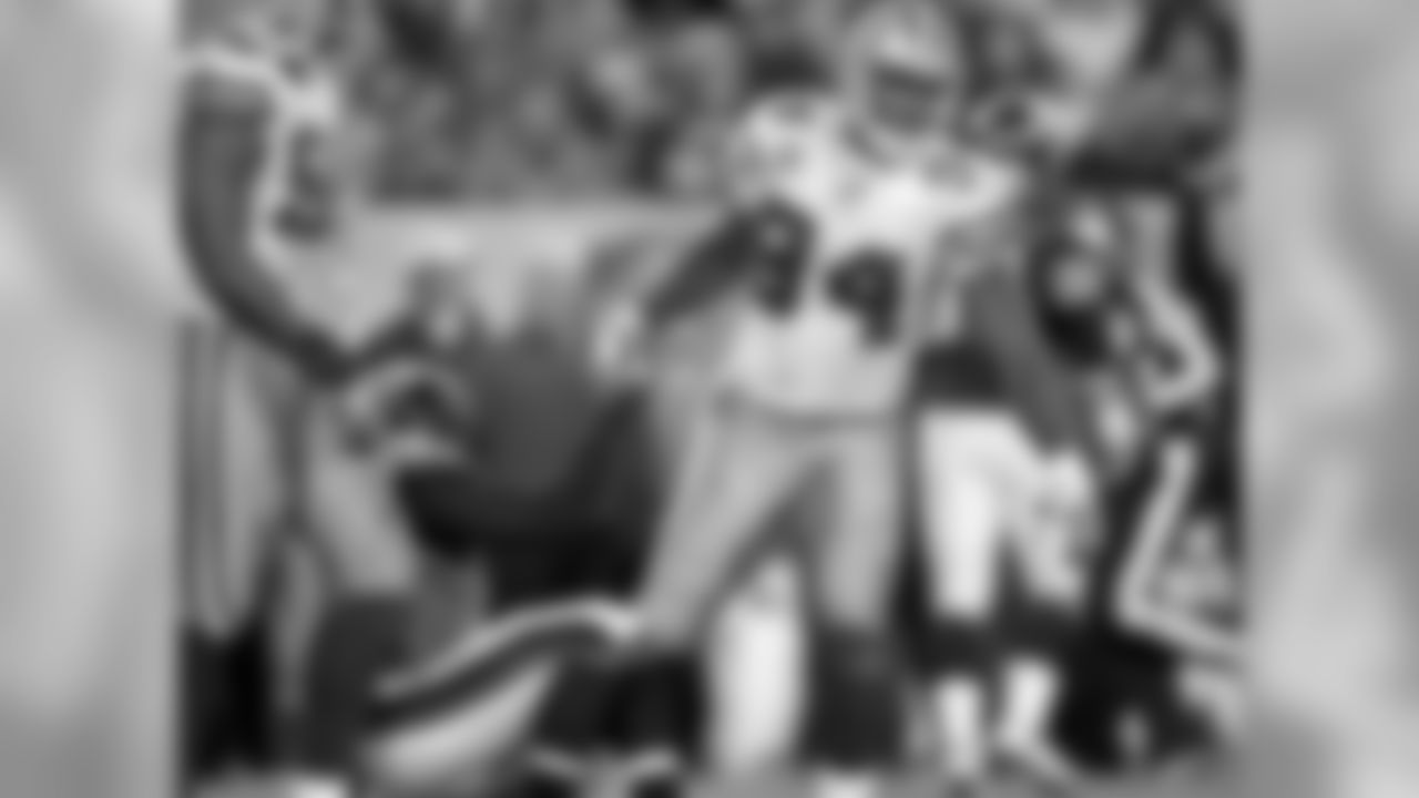 2011 - Ware helps up Eagle's QB Michael Vick after a career-best four sacks on the day. His previous best was three sacks in a game which he accomplished 7 times.
