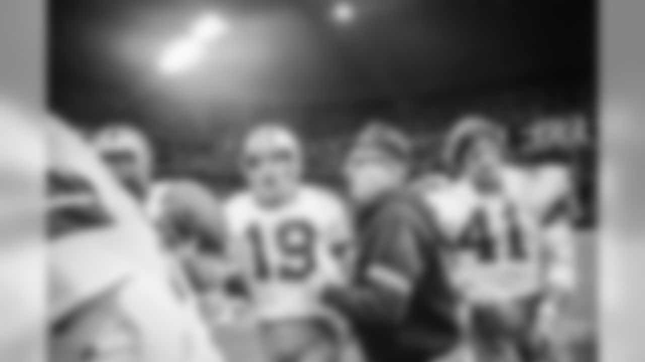 Dallas Cowboys rookie quarterback Clint Longley leaves the field in Irving, Texas Stadium on Nov. 28, 1974, with the game ball after he threw a long bomb to wide receiver Drew Pearson in final seconds of game with the Washington Redskins. The Cowboys kicked the extra point to win, 24-23. (AP Photo/Ferd Kaufman)