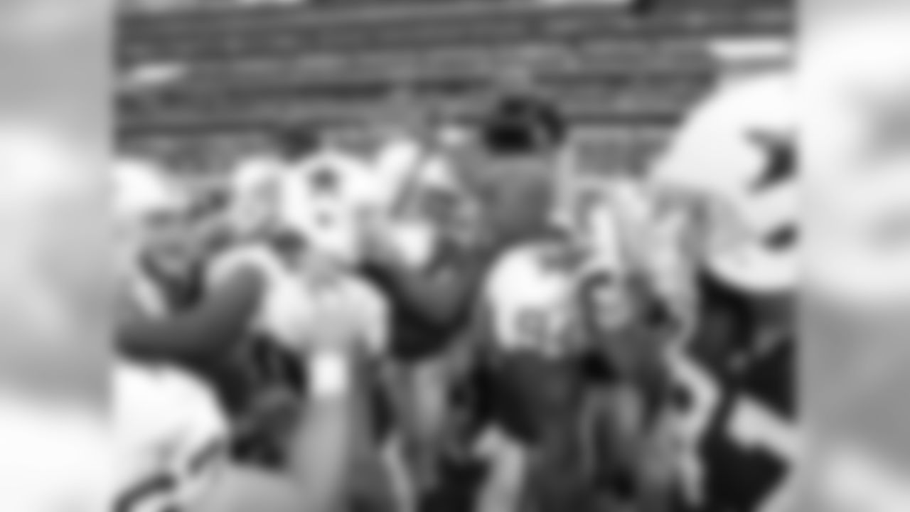 2011 - Ware gets the team pumped up in the huddle before the Dolphins-Cowboys matchup at Cowboys Stadium.