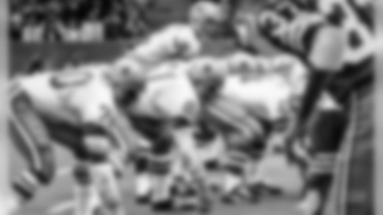 Dallas Cowboys? Roger Staubach passes scrambles and is occasionally dumped during a Redskins-Cowboys game, 1971. (AP Photo)