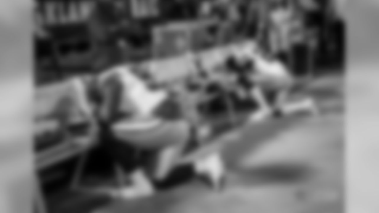 Dallas Cowboys players kneel before an NFL football game against the Oakland Raiders in Oakland, Calif., Sunday, Dec. 17, 2017. (AP Photo/Eric Risberg)