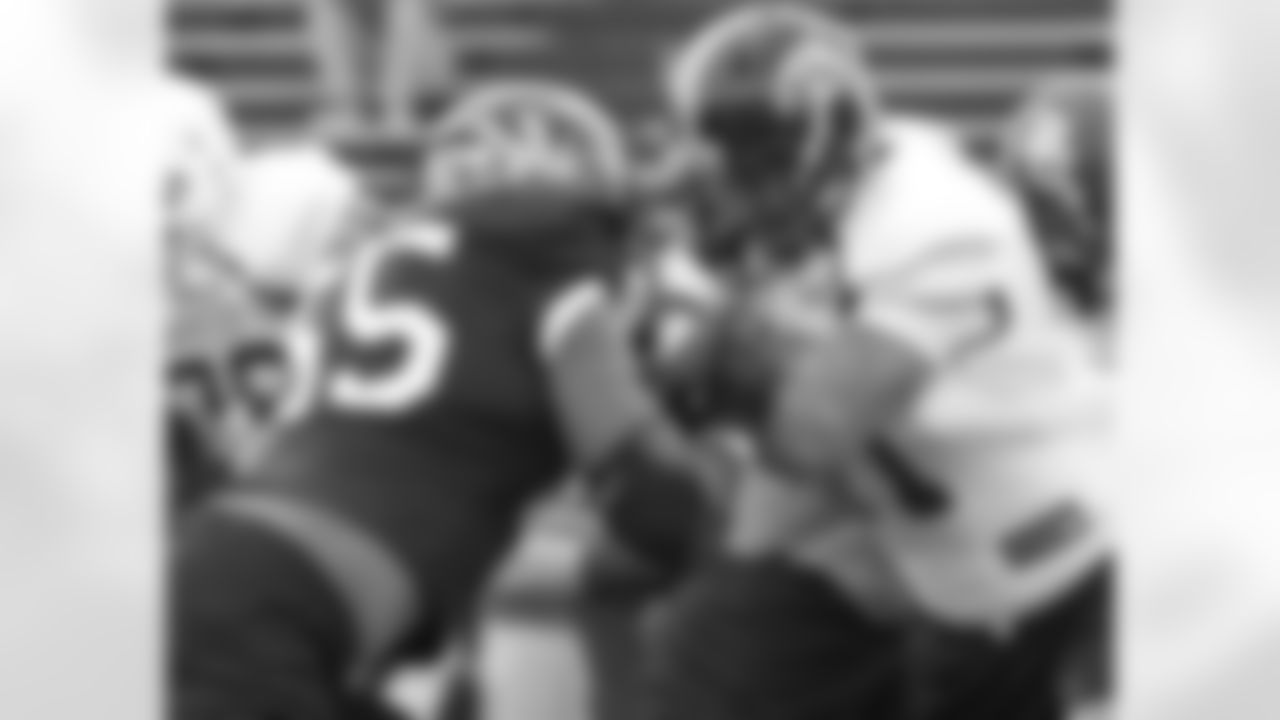 Michael Sam, playing OLB during practice.