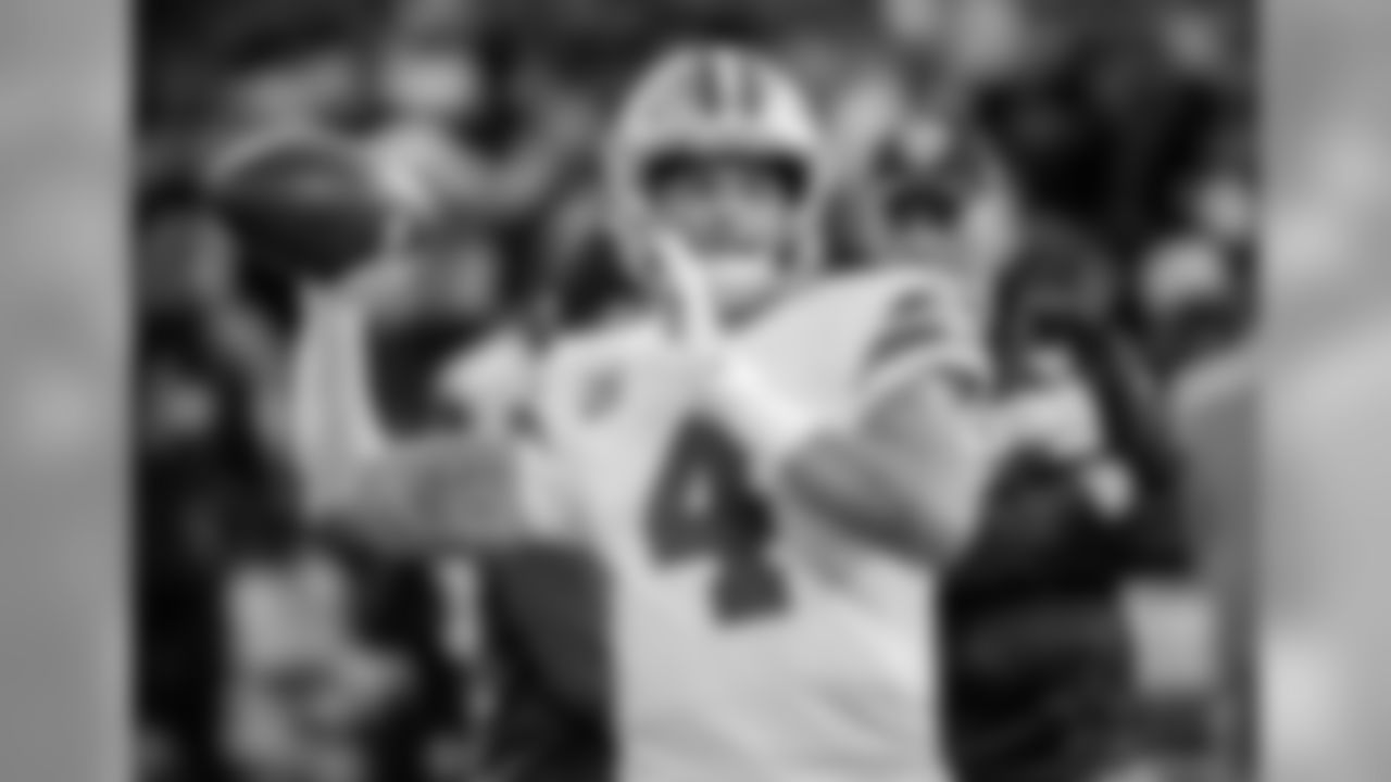 Dallas Cowboys quarterback Dak Prescott (4) warms up before an NFL football game against the Oakland Raiders in Oakland, Calif., Sunday, Dec. 17, 2017. (AP Photo/Eric Risberg)