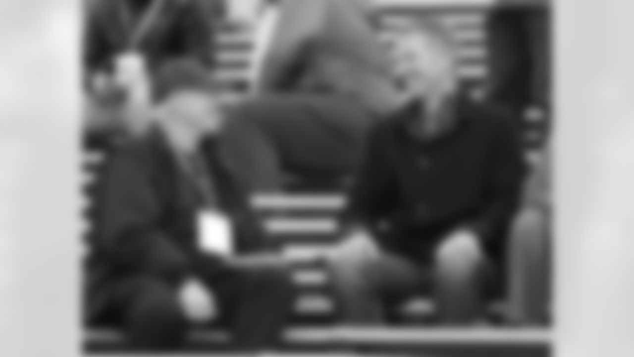 Jerry Jones and Jason Garrett look on from the stands.