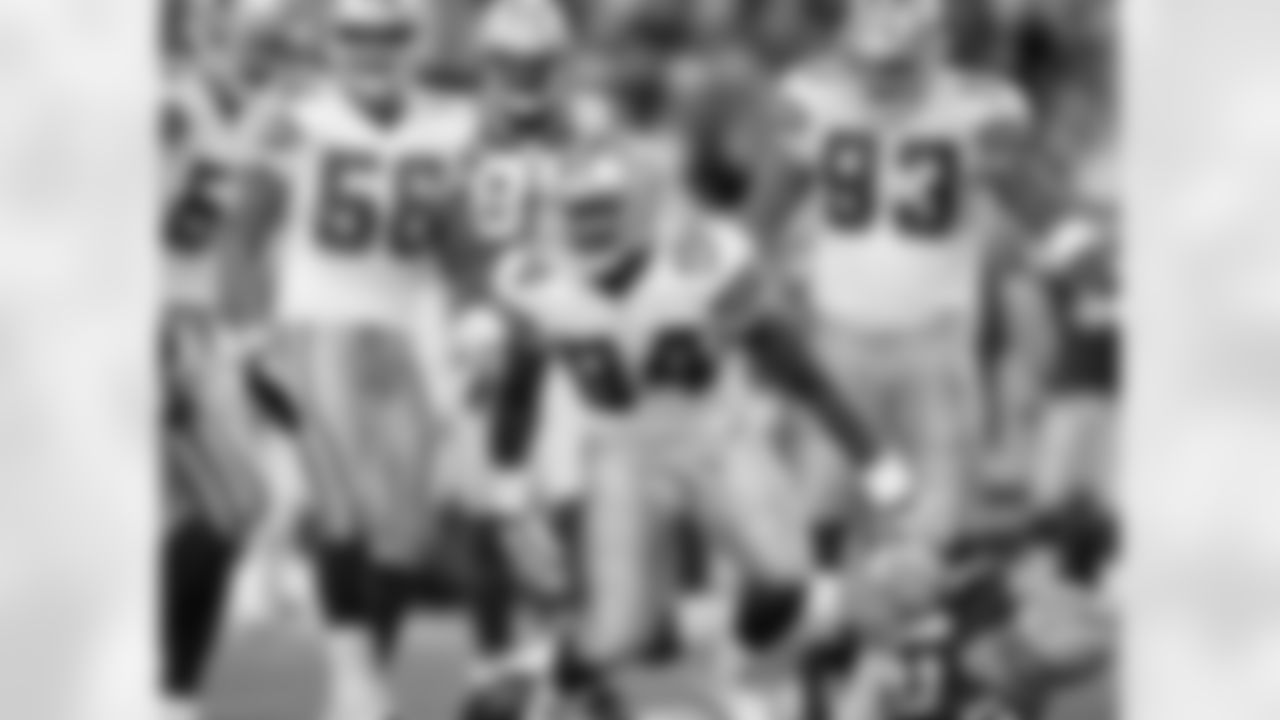 2009 - Ware celebrates after sacking Packers' QB Aaron Rodgers during a matchup in Green Bay. Ware finished the day with seven tackles, four pressures and 2.0 sacks.