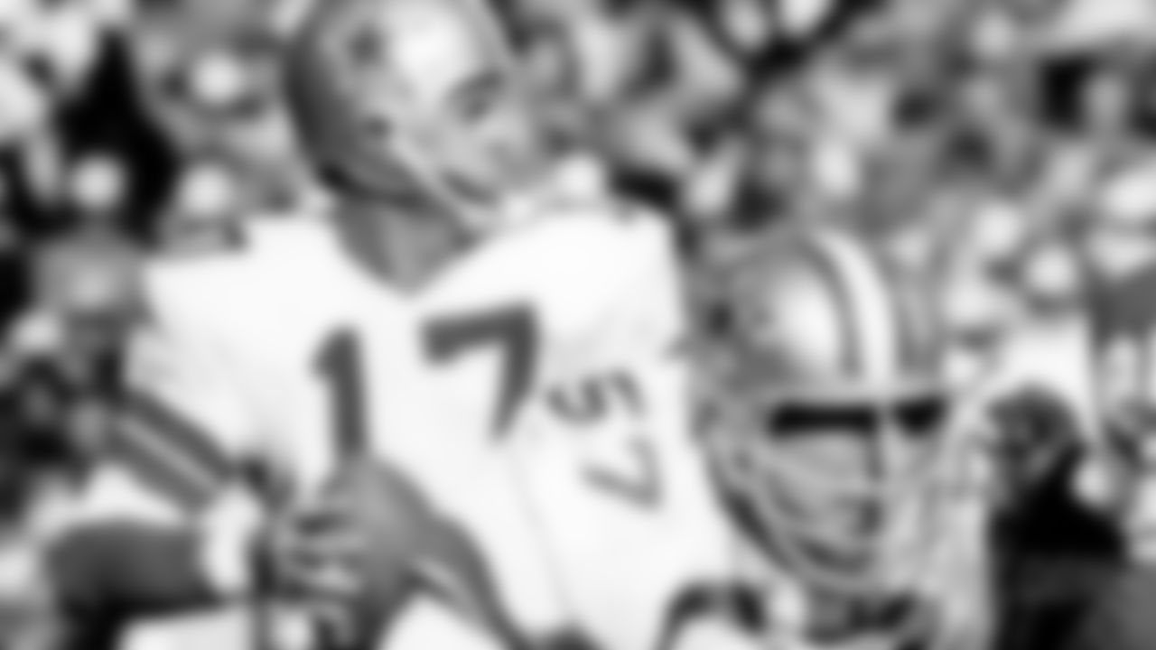 Dallas Cowboys quarterback Don Meredith (17) drops back to pass behind center Malcolm Walker (57) during an NFL game against the Minnesota Vikings, Oct. 20, 1968. The Cowboys defeated the Vikings 20-7. (AP Photo/Vernon Biever)