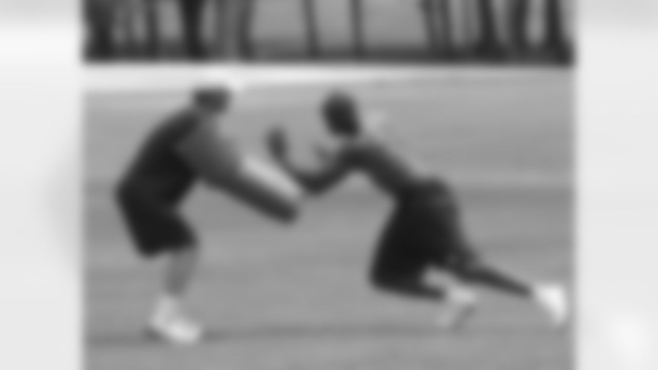 2012 - Ware running through drills with Strength and Conditioning Coordinator Mike Woicik during offseason training.