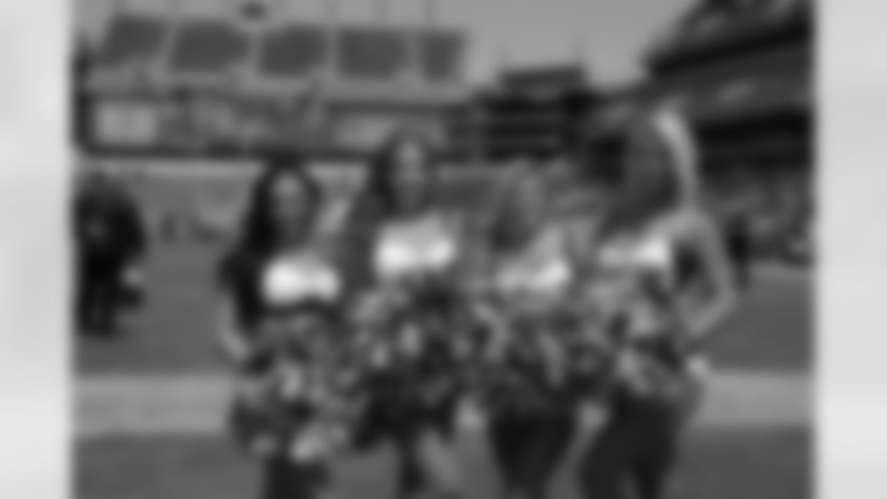 Alycia, Megan and Victoria on the sidelines during pre-game warmups