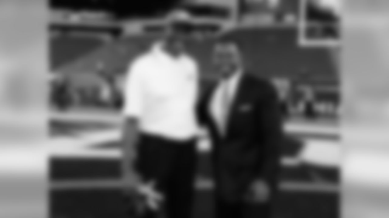 Carmichael with fellow Eagles Hall of Famer, Brian Dawkins