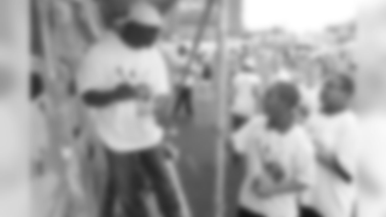 Dawkins interacts with kids at the annual Eagles Youth Partnership Playground Build