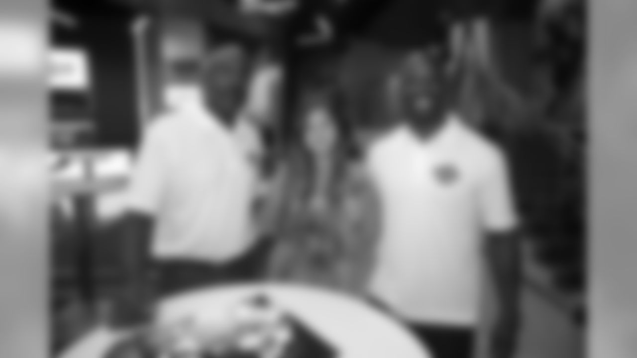 Mike Quick and Jason Avant with a lucky fan.