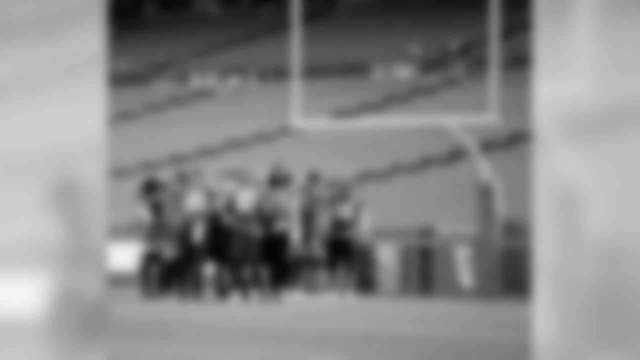 The Eagles huddle to start practice