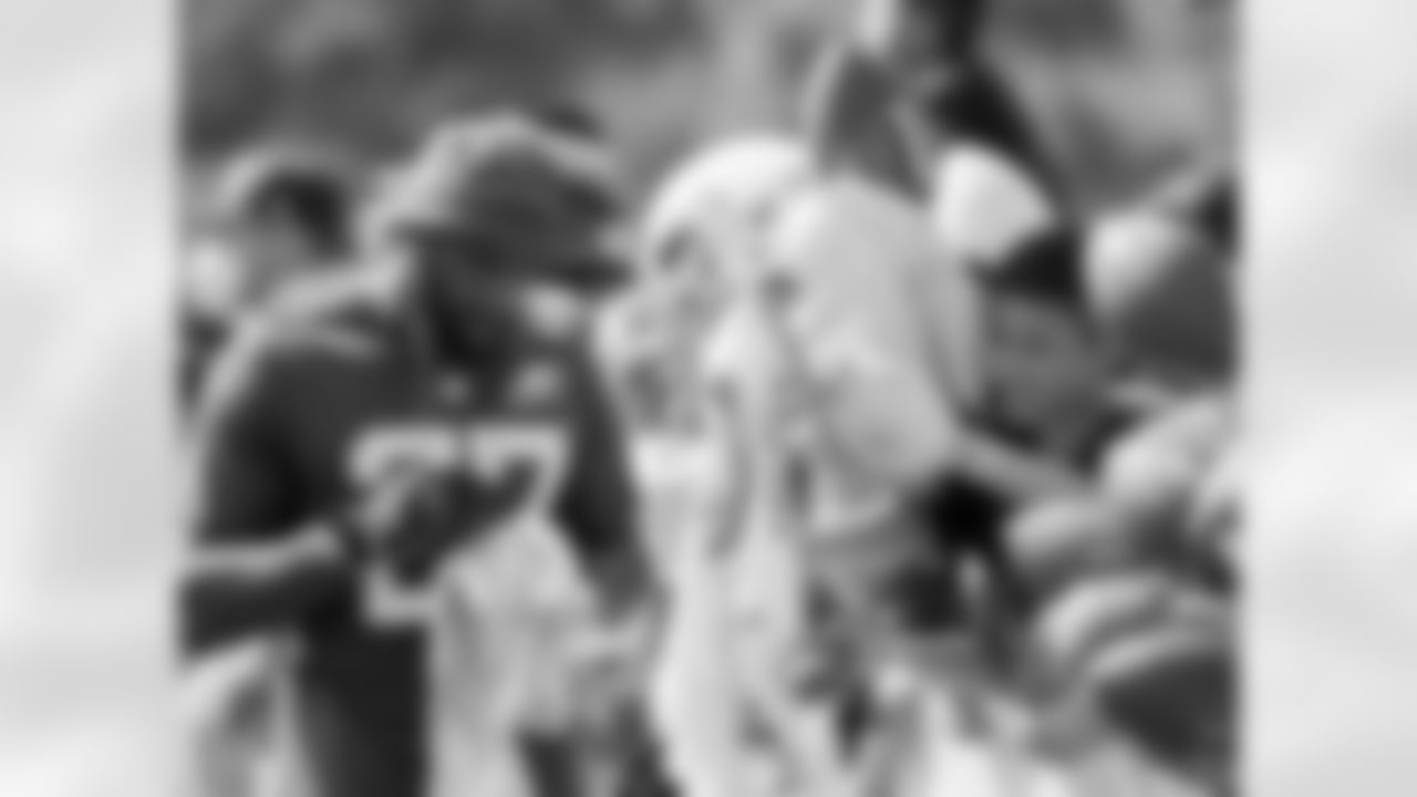 S Malcolm Jenkins signs autographs after a Pro Bowl practice