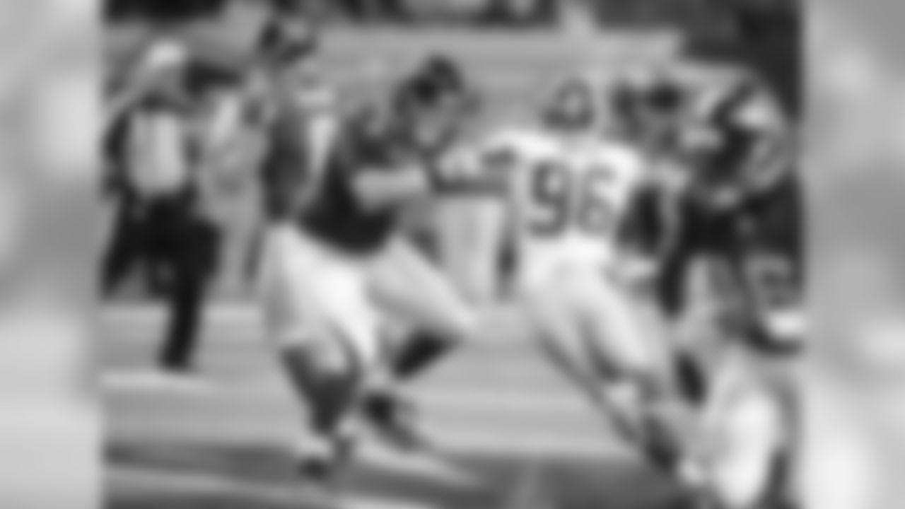 T Bryce Harris works to keep Redskins LB Houston Bates out of the backfield