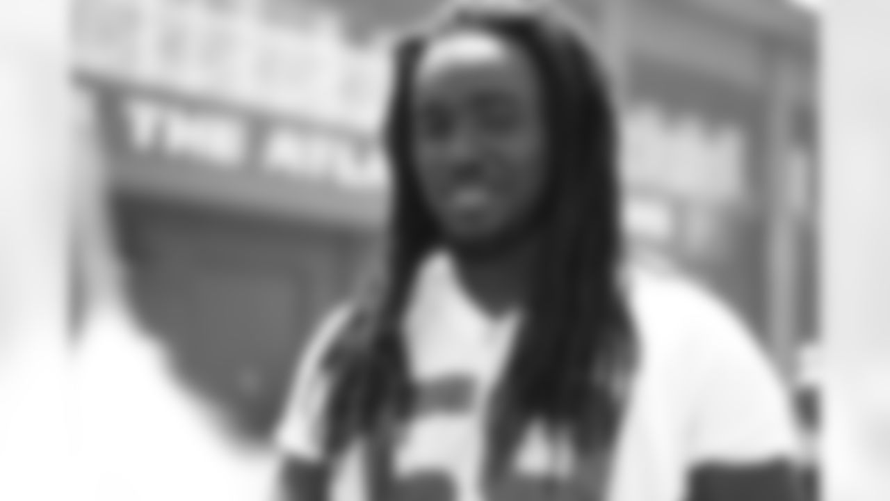 De'Vondre Campbell gets ready to speak with the media following practice