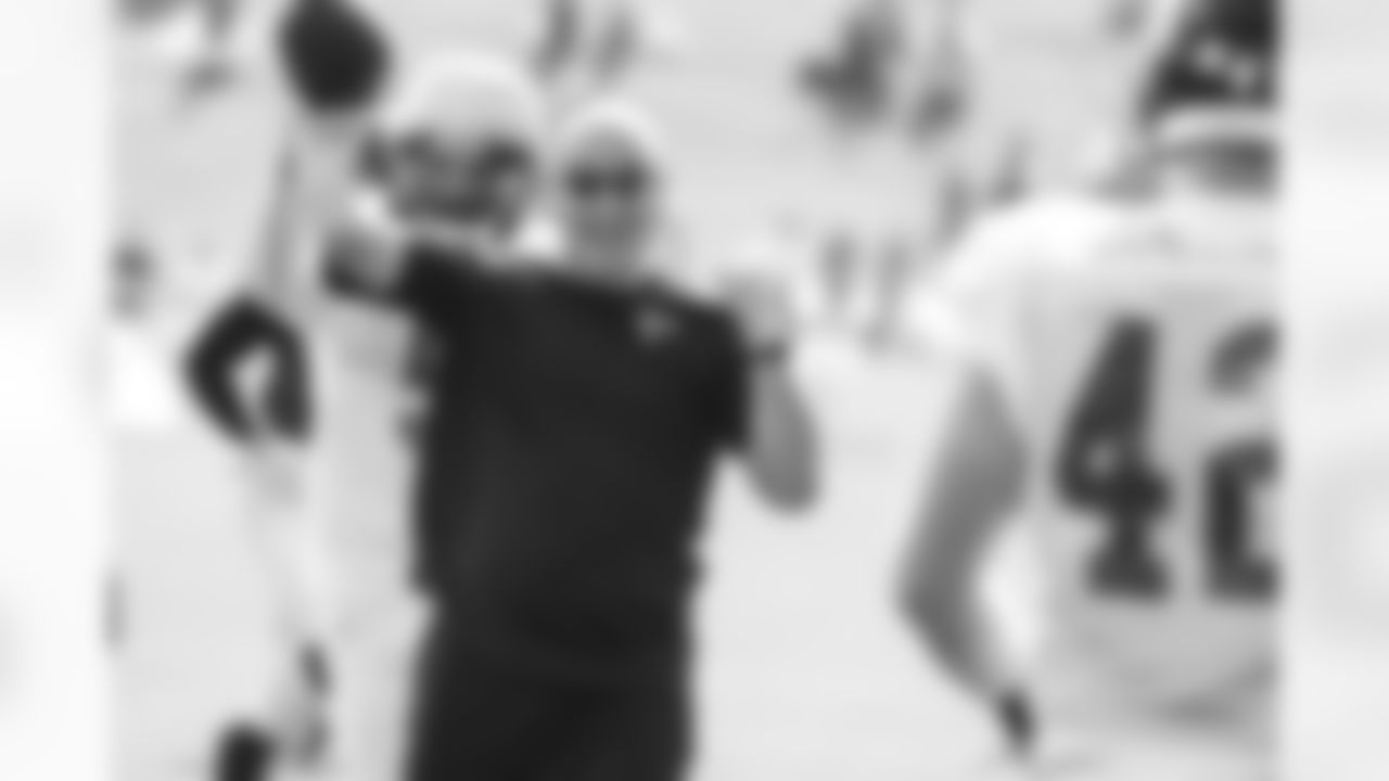 P Matt Bosher sneaks up behind def. assistant/linebackers, Chad Walker