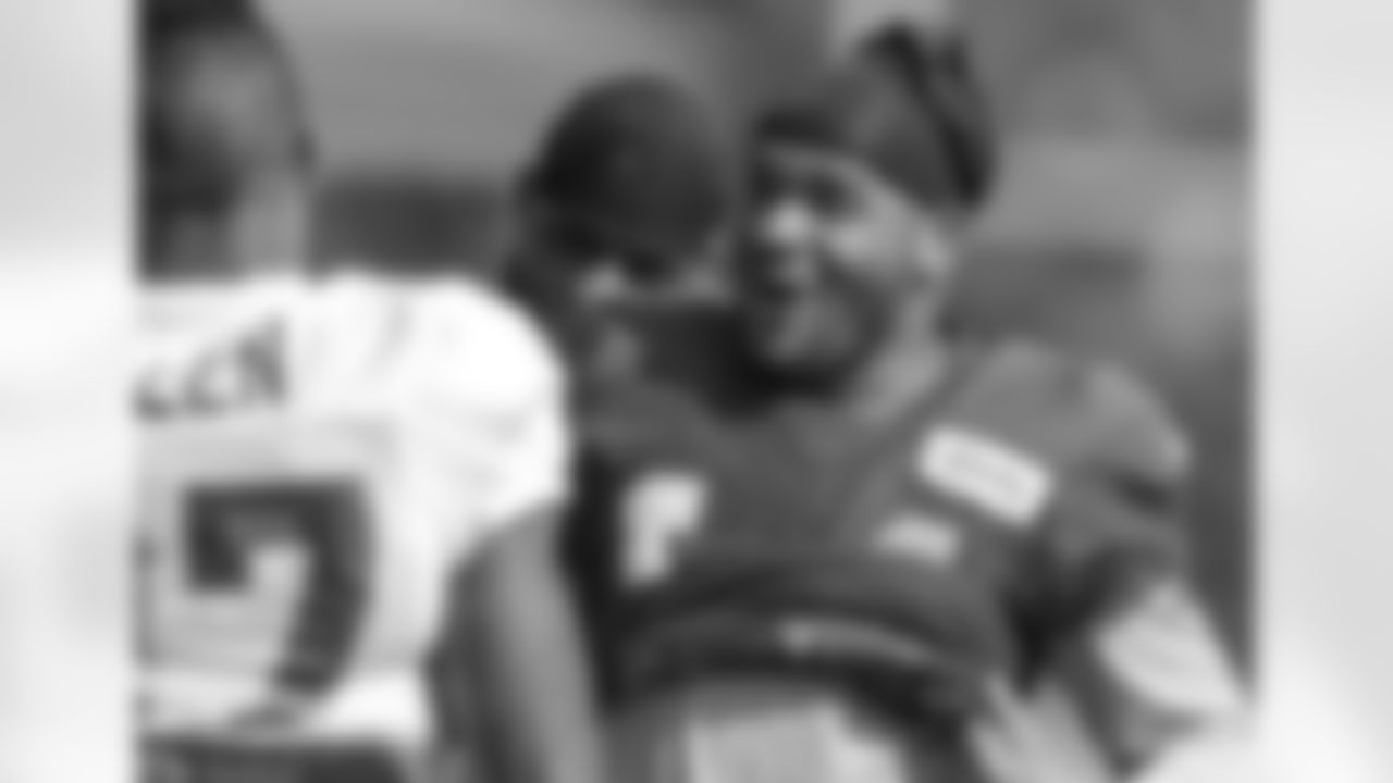 WR Eric Weems talks to CB Ricardo Allen