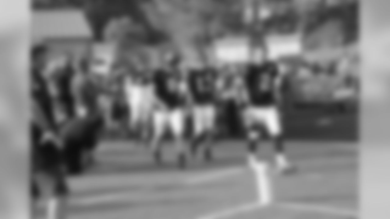 The quarterbacks took the field first at Grayson High School