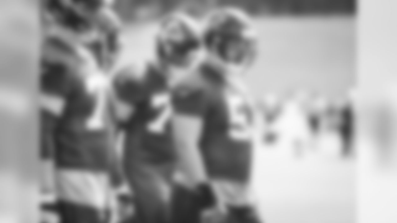 C Alex Mack (middle) leads the offensive line to the line of scrimmage