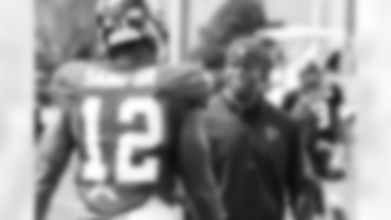 Asst. head coach / wide receivers coach, Raheem Morris, talks to WR Mohamed Sanu