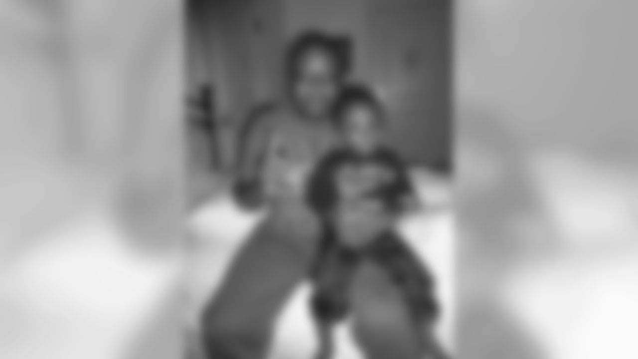 LCPL Mitchell's wife, Erikka, says, "nothing made him happier than a six pack and his Falcons on TV." He shared the love of his favorite team with his son, A.J.