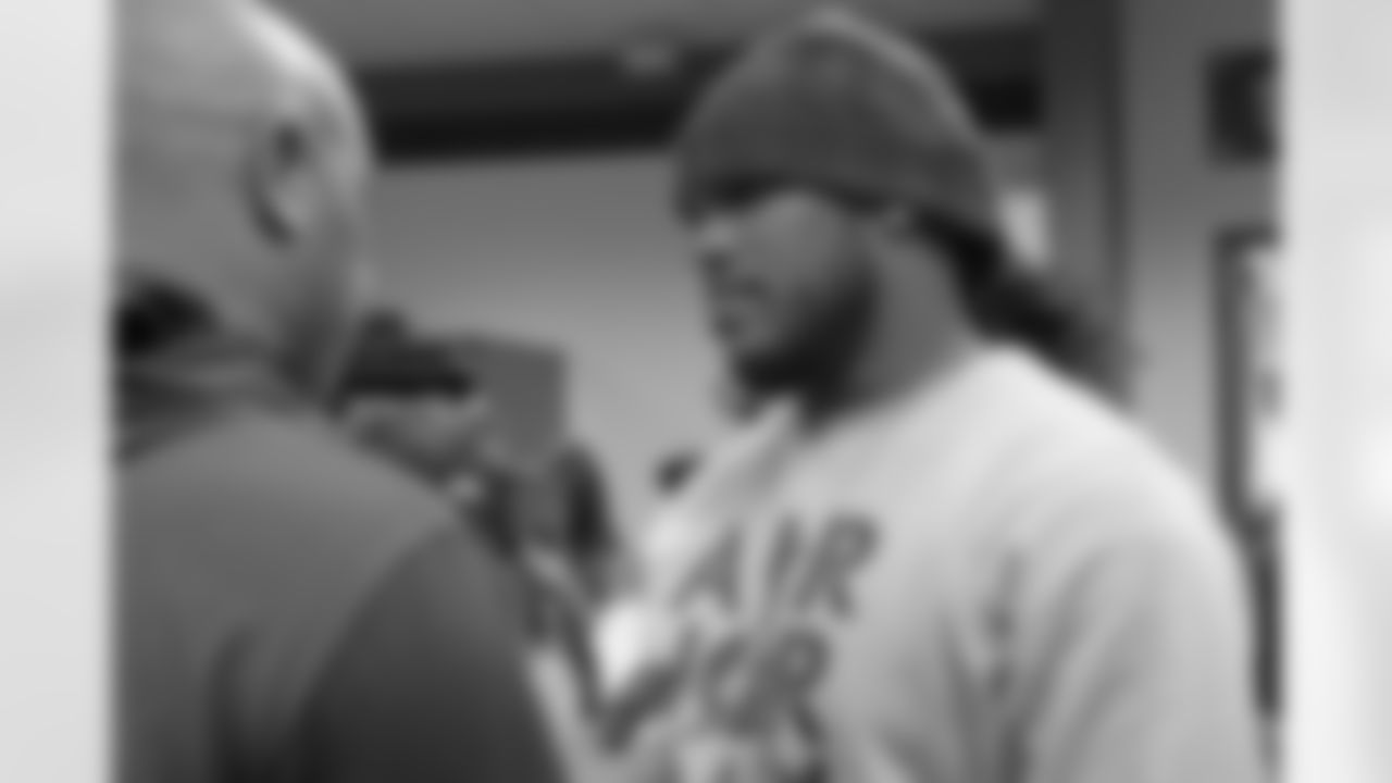 ESPN.com's Vaughn McClure, left, chats with DT Jonathan Babineaux