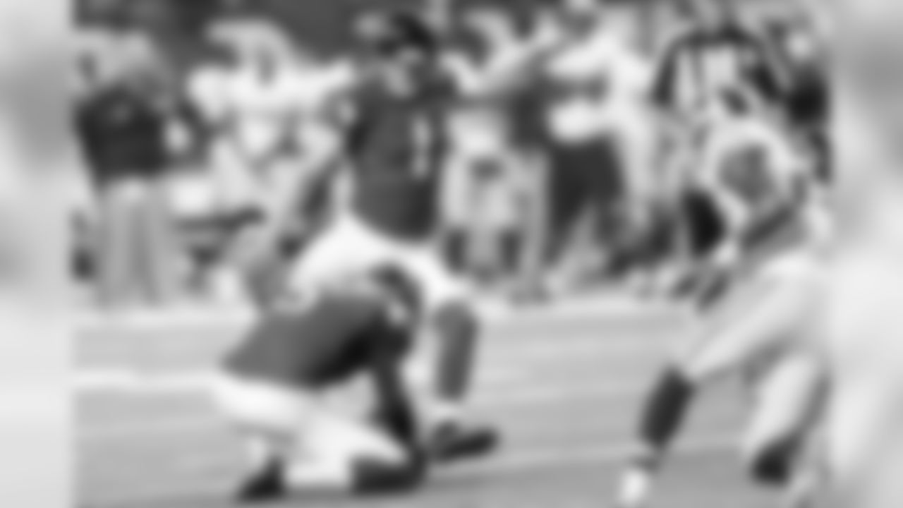 Kicker Nick Rose takes a swipe at a field goal attempt