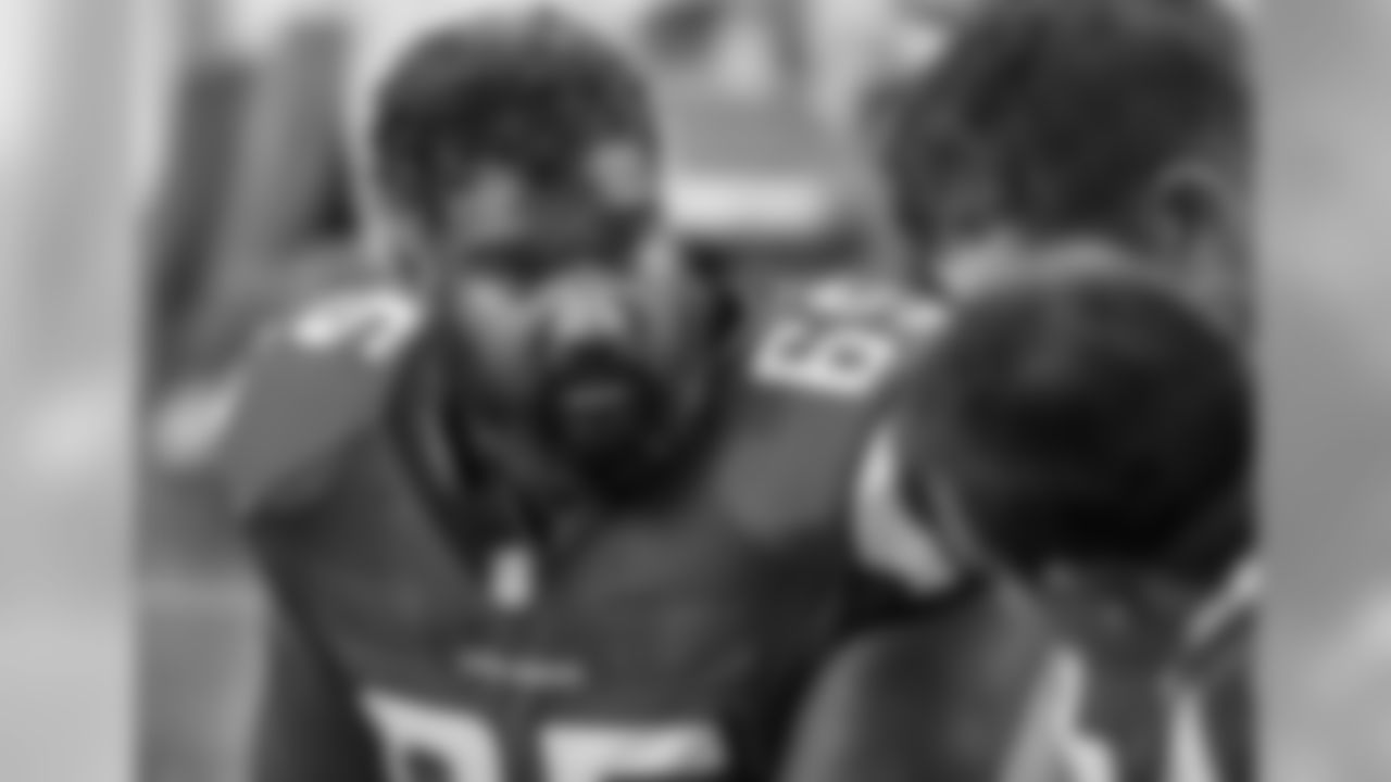 Right guard Chris Chester chats with fellow linemen on the bench