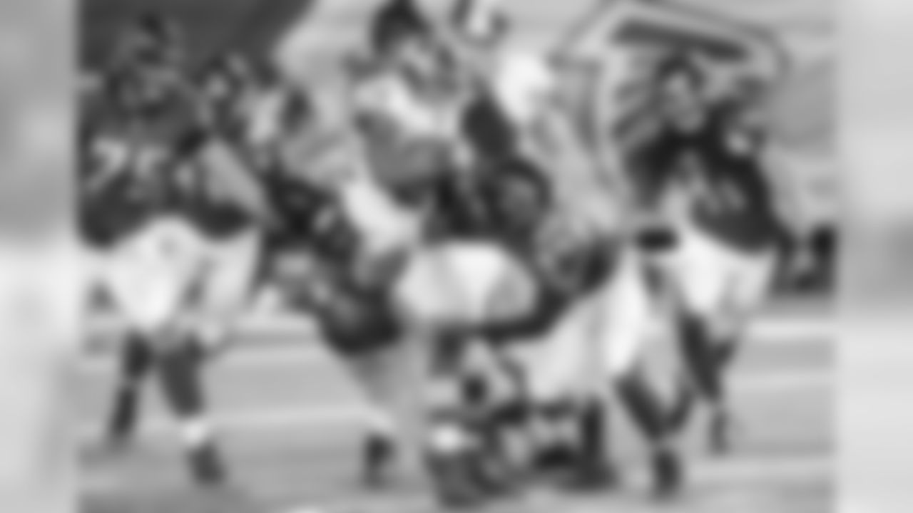 DT Cory Johnson (98) and S Damian Parms team up for a tackle