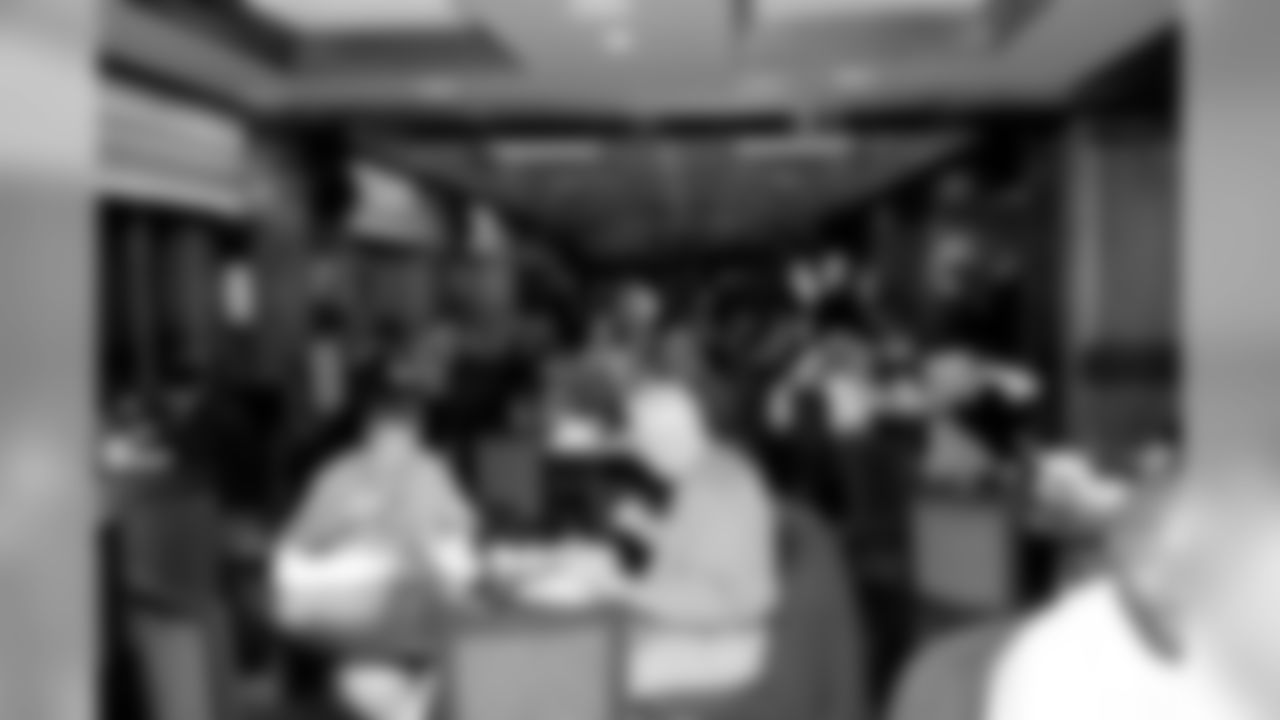 Fans Enjoying Food in the Commissioners Club