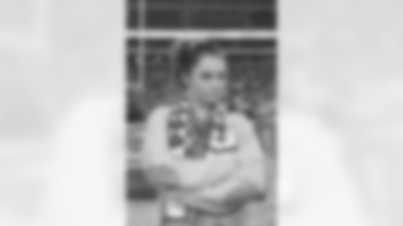 Olympic gymnast McKayla Maroney poses for a photo on the sideline before the Jets vs Patriots game.