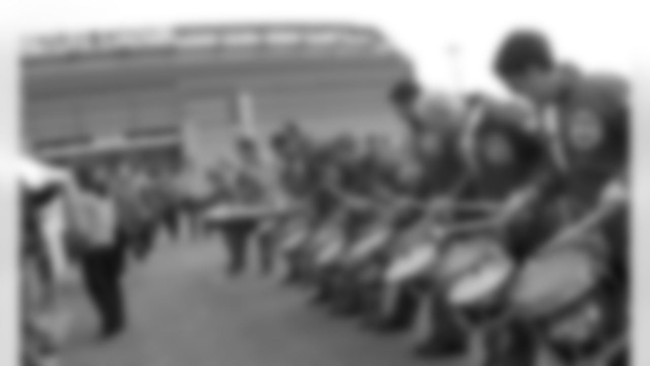 The Aviators Drumline entertains the crowd as they eagerly wait to see the players walk by.