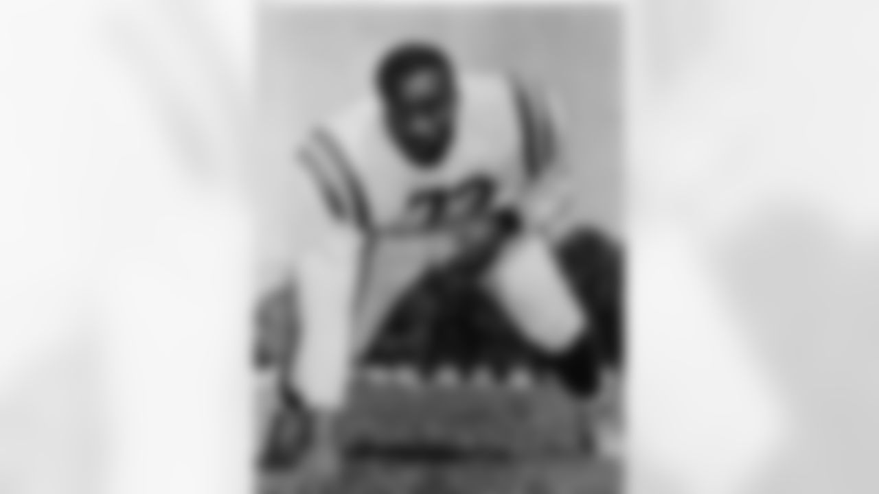 T Moses Gray with his hand in the dirt