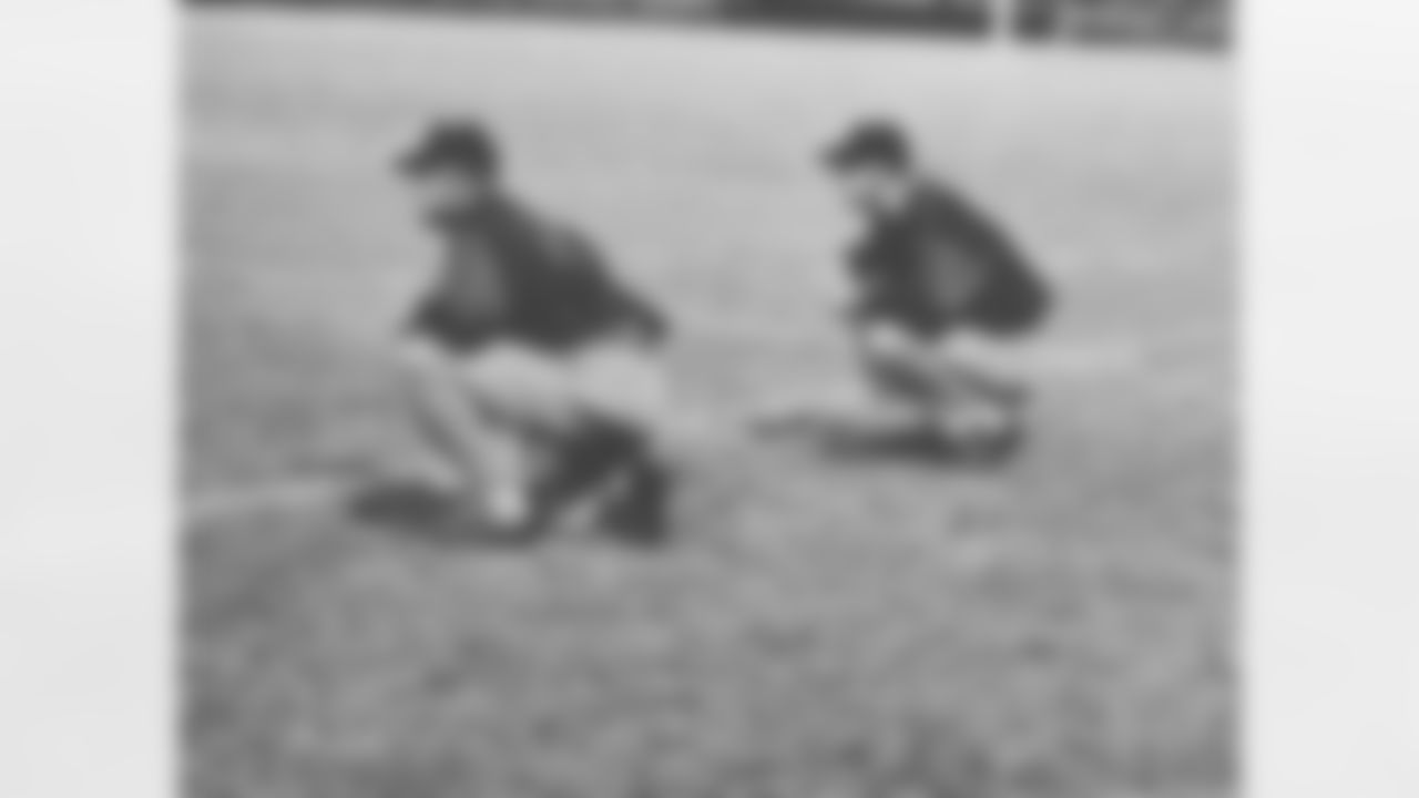 Titans coaches on their practice perches