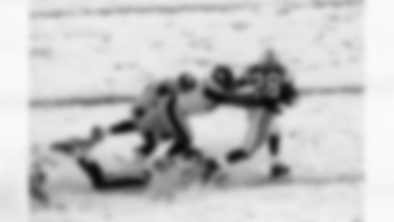 2003 - Curtis Martin runs away with the ball during the Jets vs Steelers snow filled 2003 game.